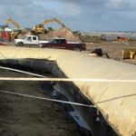 Grand Isle Hurricane Protection Project, installing geotextile tubes on beach