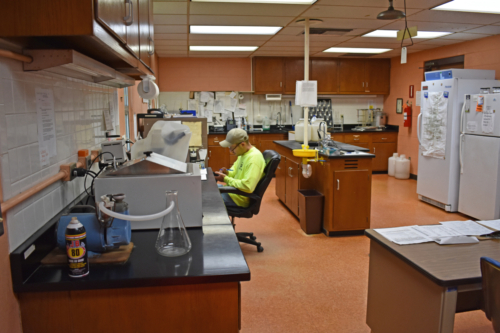 IAI operator at work in the Springbrook Wastewater Plant laboratory