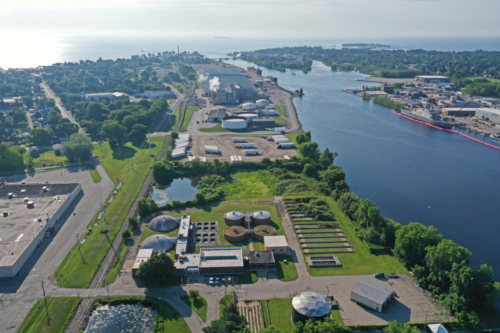Aerial view of wastewater treatment plant, looking toward Lake Michigan (Menominee River on the right)